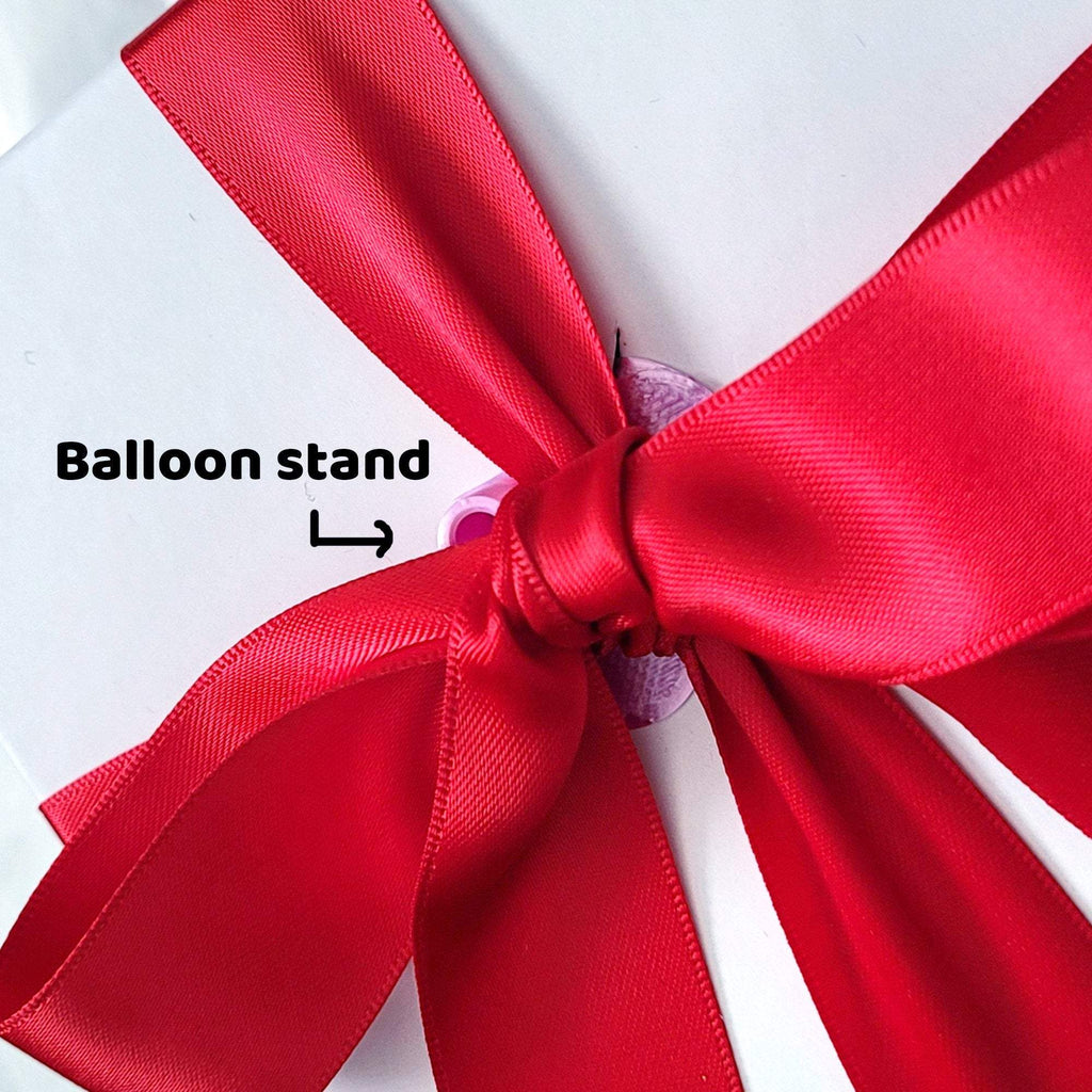 Red silk ribbon for wrapping gifts on white background. 24871843